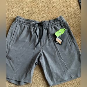 Volcom Tech shorts. NWT. Smoky grey color,drawstring waist, zipper pockets.Small
